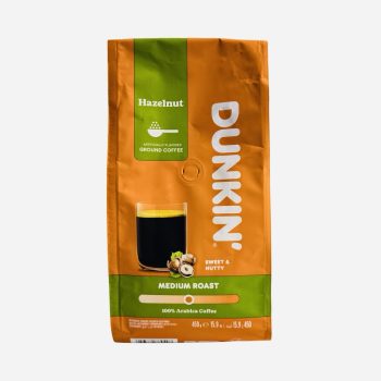 Dunkin Hazelnut ground coffee bag, orange and green, labeled Medium Roast and 100% Arabica.