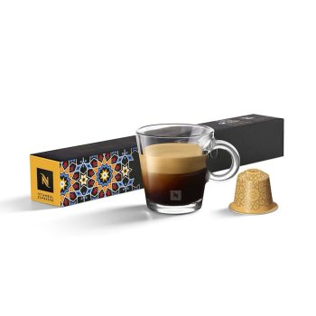 Boxed Istanbul Espresso capsules with a clear glass cup of espresso and a single capsule beside it; coffee branding visible on the packaging.